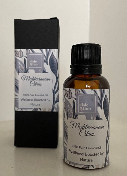 Essential oil bottle and packaging with 'Elsie & Tom' branding on a neutral background