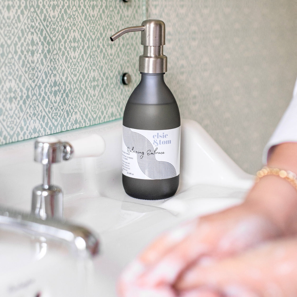 A_bottle_of_Elsie_and_Tom_hand_and_body_wash_on_the_sink