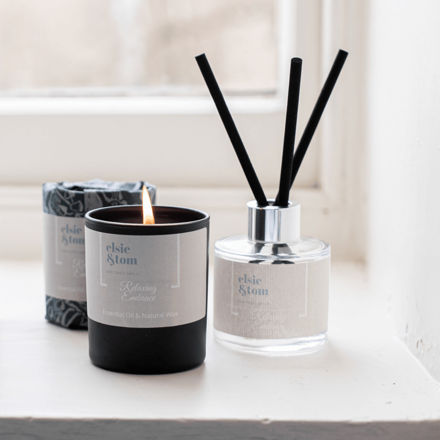 Relaxing Embrace aromatherapy wrapped candle and daily ritual reed diffuser