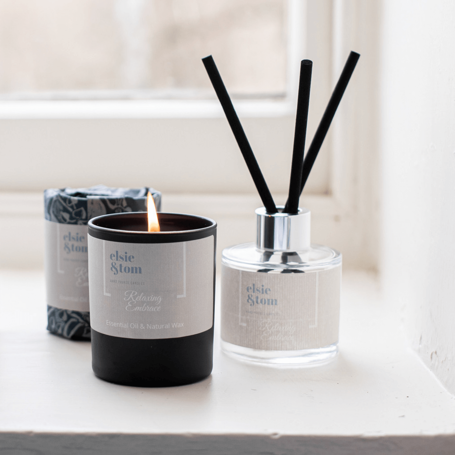 Relaxing Embrace aromatherapy wrapped candle and daily ritual reed diffuser